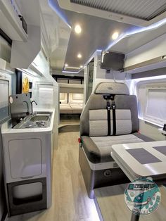 the interior of an rv is clean and ready to be used as a camper