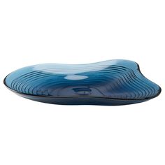 a blue glass plate with wavy lines on the bottom and black trimming around it