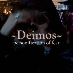 a person holding their head in front of them with the words demos written on it