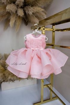 Make your little one feel like a princess with this stunning blush tutu dress, perfect for any special occasion! Whether she's a flower girl, attending a wedding as a guest, or celebrating her birthday party, she'll love the playful and girly design of this dress. The puffy skirt adds volume and movement, while the intricate floral lace detailing on the bodice and sleeves adds an extra touch of elegance. Handmade with care, this dress is perfect for your toddler or infant to make unforgettable memories in. She'll feel confident and beautiful in this special occasion outfit, and you'll love seeing her shine! Features: - knee length - puffy  skirt  - sleeveless  By request color can be other. We have more then 80 shades of tulle color ACCESSORIES   By request baby dress can be with:  - Baby Princess Style Organza Tutu Dress For Baptism, Elegant Organza Dress For Birthday, Pink Ruffled Princess Dress For Baptism, Pink Organza Princess Dress For Dress-up, Elegant Pink Baptism Dress For Spring, Pink Organza Princess Dress With Ruffles, Fitted Sleeveless Pink Baptism Dress, Elegant Sleeveless Pink Princess Dress, Elegant Ruffled Tutu Dress For Birthday