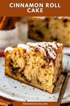 a slice of cinnamon roll cake on a white plate with cinnamon sticks in the background