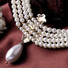 Up the elegance of your date-night ensembles with this gold-plated necklace that features gorgeous pearl accents. Chain : 15.75" L with 3.15" extender Pendant : 1.38" W x 3.15" L Lobster claw clasp 18k gold-plated copper / pearl / cubic zirconia / crystal Grunge Chokers, Women Birthday Party, Romantic Party, Choker Pearl, Simple Choker, Pendants For Women, Pearl Strands Necklace, Gold Chain Choker, Pearl Strand