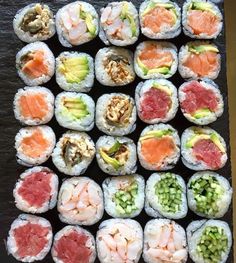 sushi rolls are arranged in the shape of a square