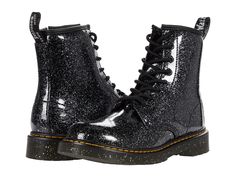 PRICES MAY VARY. EDGY DR. MARTENS DESIGN: The Dr. Martens Kid's Collection 1460 Lace Up Fashion Boot brings a touch of rebellious style to any outfit. Crafted from soft leather, these kids boots retain the classic Dr. Martens features including grooved edges and a signature yellow stitching. Perfect for kids who want to showcase their edgy side, these boots provide a bold statement while staying true to the iconic Dr. Martens aesthetic. PREMIUM COMFORT: Designed with a superbly-soft leather uppe Trendy Glitter Boots With Round Toe, Casual Glitter Boots With Round Toe, Casual Glitter Boots For Party, Casual Glitter Party Boots, Black Glitter Accented Round Toe Boots, Dr Martens Black, Stylish Boots, Comfortable Boots, Goodyear Welt