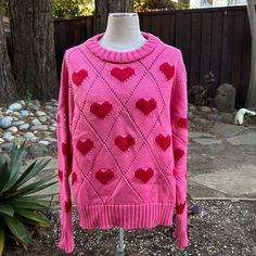 100% Merino Wool Cotton Heart Print Sweater For Fall, Casual Spring Sweater With Heart Graphic, Trendy Cotton Sweater With Heart Print, Fitted Heart Print Sweater For Fall, Trendy Winter Sweater With Heart Graphic, Fitted Winter Top With Heart Print, Knit Tops With Heart Print For Winter, Heart-shaped Knitted Sweater For Fall, Casual Heart Print Sweater For Winter