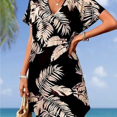 Batwing Dress Tropical Vibes Knee-length Black Mini Dress For Vacation, Black Knee-length Mini Dress For Vacation, Black Floral Print Dresses For Beach Season, Casual Black Mini Dress For Vacation, Chic Black Mini Dress For Beach Season, Brown Knee-length Mini Dress For Beach, Black V-neck Mini Dress For Beach Season, Brown Knee-length Mini Dress For The Beach, Batwing Dress