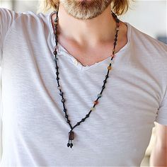 This men's necklace is a striking handcrafted piece made with an eclectic mix of natural gemstones, offering a perfect balance between rugged elegance and spiritual significance. The necklace, featuring polished onyx, agate, carnelian, and jasper beads, is strung on a durable black cord with a raw stone pendant, making it a versatile accessory that blends earthy tones with vibrant accents. * Natural Gemstones: Includes Onyx for grounding and protection, Agate for harmony, Carnelian for motivatio Adjustable Onyx Beaded Necklace In Bohemian Style, Adjustable Onyx Bohemian Beaded Necklace, Bohemian Adjustable Onyx Beaded Necklace, Adjustable Carnelian Necklace Hand Wrapped, Adjustable Hand Wrapped Carnelian Necklace, Adjustable Onyx Bohemian Necklace, Bohemian Adjustable Onyx Necklace, Adjustable Bohemian Onyx Necklace, Adjustable Onyx Necklace With Spiritual Style