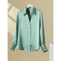 Discover Elegance and Comfort Step into the season of renewal with our Chic 100% Silk V-Neck Blouse, a perfect blend of luxury and practicality. Designed for the modern woman, this blouse embodies sophistication with its sleek, straight fit and turn-down collar. Whether you're heading to the office or a casual day out, this blouse is your go-to for an effortlessly stylish look. Exceptional Features Our silk blouse boasts a range of features that set it apart. The single-breasted closure adds a c Silk Tops For Women Classy, Casual Silk V-neck Tops, Casual Silk Button-up Tops, Chic Silk V-neck Blouse, Chic Silk Blouse With 3/4 Sleeves, Silk Tops For Women, Green Silk Button-up Blouse, Silk Tops, Blouse For Women