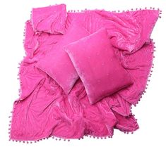 two pink pillows sitting on top of each other next to a pillow case with pom - poms