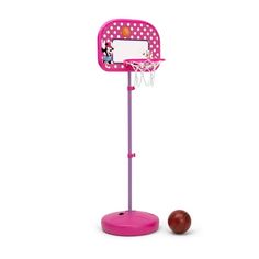 a toy basketball hoop with a ball on the ground