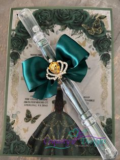 a close up of a pen with a bow on it