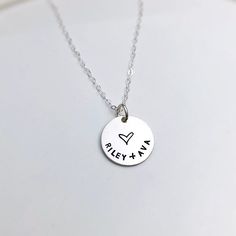 "Personalized Anniversary Necklace Valentine's Gift for Wife, Forever Necklace, Initials Necklace, Valentine's Day Gift for Her One 5/8\" sterling silver disc is personalized with the names of your choice, with a beautiful heart. It hangs from a dainty sterling silver cable chain. * choose your length from the drop down box. It comes ready for gift giving in a cute kraft paper box tied with a ribbon." Engraved Sterling Silver Jewelry For Valentine's Day, Customizable Silver Jewelry For Anniversary Gift, Anniversary Stainless Steel Necklace, White Hand Stamped Anniversary Necklaces, Nickel Free Jewelry For Anniversary On Valentine's Day, Stainless Steel Jewelry For Birthday And Valentine's Day, Adjustable Sterling Silver Meaningful Charm Necklaces, Personalized Meaningful Jewelry For Valentine's Day, Personalized Sterling Silver Jewelry For Valentine's Day