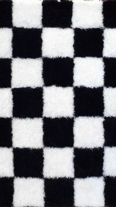 a black and white checkered rug is shown