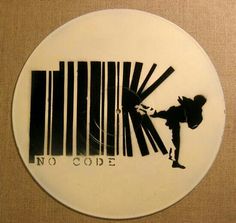 a white plate with a barcode design and a silhouette of a man doing karate