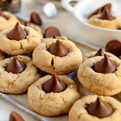 chocolate chip cookies on a tray with white bowls in the background