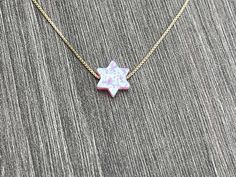 This beautiful Star of David /Magen David/Jewish Star Opal Necklace is sure to be someone's favorite. It's a great Bat Mitzvah or Hanukkah gift. Sterling Silver or 14kt Gold Filled Charm Size: 10mm Lab Created Opal Your Choice of Length and Color Chain Styles: 0.7mm Box Chain Disclaimer: Before placing an order for a necklace or bracelet, please ensure you measure your desired size carefully. Customers are fully responsible for choosing the correct length, as all cut chains are non-refundable. I Star Of David Charm Jewelry Gift, 14k Gold Star Of David Jewelry Gift, 14k Gold Star Of David Necklace Gift, Gift 14k Gold Star Of David Necklace, Star Of David Necklace For Hanukkah Gift, Hanukkah Gift Necklace With Star Of David, Spiritual Jewelry For Hanukkah Gift, Star Of David Necklace For Gift, Judaica Jewelry