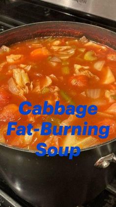 a pot filled with soup sitting on top of an oven