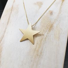 "I'll fabricate this star necklace, in sterling silver, with a 24K gold plating on both the star pendant and the 18\" sterling silver box chain. This is a 5 point star which is 1 1/8 inches in diameter, so it's a substantial size (not minuscule) and will stand out upon your chest when worn. It's 22 gauge in thickness. It's inspired after Stevie Nicks' smaller sized star necklace. For those enjoying the simple style of star necklaces, then here's a perfect one to last a lifetime of wear and enjoy Nickel-free Star-shaped Celestial Necklaces, Nickel-free Adjustable Star Necklace, Gold Nickel-free Star Of David Necklace, Star Necklaces, 5 Point Star, Silver Star Necklace, Nickel-free Sterling Silver Star Charm Necklace, Star Celestial, Nickel-free Sterling Silver Star Of David Necklace