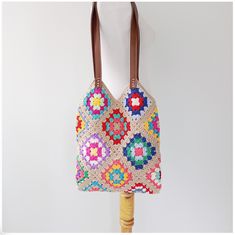 Bohemian Multicolor Double Handle Beach Bag, Bohemian Crochet Shopping Bag, Multicolor Crochet Tote Bag With Adjustable Strap, Multicolor Crochet Bucket Bag, Multicolor Crochet Bag With Leather Handles, Multicolor Crochet Bag With Adjustable Strap For Shopping, Beige Granny Square Bags For Vacation, Multicolor Crochet Bucket Shoulder Bag, Multicolor Crochet Shoulder Bag For Travel