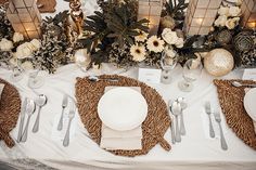 the table is set with silverware and place settings for an elegant dinner or reception