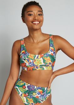 Dive deep into the retro tropics with this white tank bikini top and your vivid vacation will never end. This cropped swim top from our ModCloth namesake label is decked out in a bold, vintage-inspired tropical floral print that is exclusive and super unique thanks to the colorful parrots in paradise that are moseying about the flora that is made-up of vibrant shades of blue, green, orange, yellow, and red atop the white background. Along with comfy padding at the bust and an adjustable back hoo Vintage Style Swimwear, Retro Tropical, Tank Bikinis, Casual Dresses Plus Size, Resort Outfit, Colorful Parrots, Tunic Hoodie, Vintage Swimwear, Seaside Resort