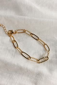 Image shows the Bethany Gold Textured Chain Link Bracelet against a white background. Bracelet has gold textured oval links. Luxury Wheat Chain Link Bracelet, Alphabet Charms, Day To Night, To Night, Gold Texture, Chain Link Bracelet, Link Bracelets, Gold Finish, Chain Link