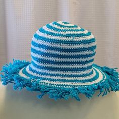 Our hats provide optimal coverage for a day at the beach or the pool. Try this fun look with silly fringe and stripes... a fun new twist on our most popular item! Variety of colors available. Hand crocheted, 100% cotton, washable Colorful Adjustable Crochet Hat For The Beach, Playful Crochet Hat For Beach, Playful Beach Crochet Hat, Multicolor One-size Crochet Hat For Beach, Fun Green Crochet Beach Hat, Fringe Hat, Crochet Fringe, A Day At The Beach, Day At The Beach