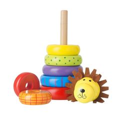 a stack of colorful toys with a lion on top