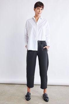 A Pinstripe version of our famous Wide-ish Pants — these pants are a standout yet comfortable pair. Style with your favorite blouse or top for an easy, everyday style. Hits above the ankle Slight stretch Relaxed fit Tapered leg Side pockets Casual Pinstripe Ankle-length Pants, Casual Pinstripe Pants For Work, Relaxed Fit Bottoms With Vertical Stripes For Work, Spring Pinstripe Ankle-length Pants, Casual Striped Pants For Business Casual, Spring Workwear Bottoms With Striped Hem, Pinstripe Ankle Pants For Business Casual, Pinstripe Ankle-length Pants For Business Casual, Pinstripe Ankle-length Bottoms For Business Casual