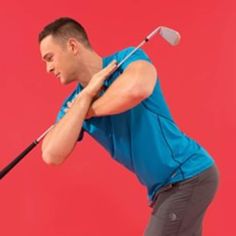 a man is swinging his golf club at the same time as he swings it with one hand