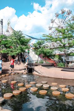 children playing in the water at an amusement park