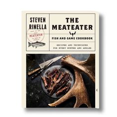 the meateater fish and game cookbook is shown in front of an antler