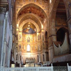 the interior of an old church with paintings on the walls