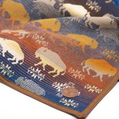 a close up of a tie with animals on it