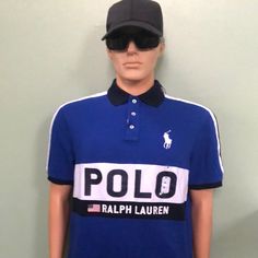 Nwt Polo Ralph Lauren Logo Classic-Fit Cotton Short-Sleeve Polo - Size M. Polo Features Short-Sleeves, Functional 1/4-Button Front Closure, Collar, Breathable Cotton Fabric Construction, Stitched Logo Emblem & Printed Brand Name Emblazoned On Front Of Shirt, And A Slight Hi-Lo Style (Slightly Longer In Back That In Front) W/ 1.5in Slits/Vents From Hemline On Either Side Measurements: Length: 28 Bust: 44 Waist: 44 Color/Pattern: Blue/Ivory/Red, Stripe/Logo Material: Cotton Collared Tops With Logo Print For Summer, Summer Collared Tops With Logo Print, Summer Collared Top With Logo Print, Navy Polo Collar Top For Spring, Fitted Blue Tops With Logo Print, Classic Fitted Blue T-shirt, Blue Fitted Collared T-shirt, Fitted Navy T-shirt For Spring, Blue Shirt With Logo Print For Spring