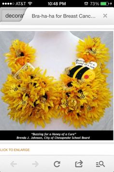 a mannequin made out of sunflowers with a bee on it's chest