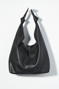 This oversized tote is your new BFF. Tied with two playful knots, this just-right sized, slouchy silhouette is designed to hold all your essentials (and more!) effortlessly – and with a touch of oh-so-fashionable flair. | The Love Knot Slouchy Bag by Anthropologie in Black, Women's, Polyurethane Slouchy Tote, Slouchy Bag, Slouch Bags, Hobo Tote Bag, Minimalist Accessories, Laptop Bag For Women, Perfect Handbag, Black Leather Tote Bag, Oversized Tote