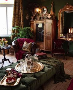 a living room filled with lots of furniture and decor on top of a hard wood floor