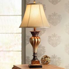 a lamp sitting on top of a wooden table