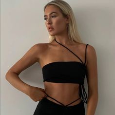 Never Worn, True To Size Black Crop Top For Club In Spring, Trendy Black Crop Top For Evening, Chic Black Crop Top For Date Night, Black Crop Top For Spring Party, Black Crop Top For Summer Night Out, Black Edgy Crop Top, Black Crop Top For Spring Night Out, Black Crop Top For Summer Date Night, Black Crop Top For Date Night In Summer