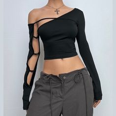 Please refer to our sizing chart for a guideline when choosing a size. 5 business days order processing time. 90% polyester 10% spandex Edgy Hollow Out Tops For Party, Edgy Black Top With Asymmetrical Zip, Edgy Fitted Top With Zipper Closure, Victorian Gothic Dress, Edgy Fitted Cutout Crop Top, Black Stretch Hollow-out Tops, Leather Crop Top, Alt Clothes, Baby Tees Y2k