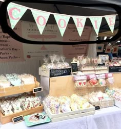 a table topped with lots of cakes and desserts