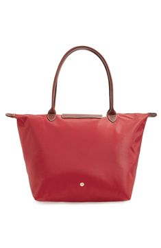 Smooth, sleek nylon and embossed leather trim make this spacious tote a no-brainer for everyday versatility and elegance. An inside pocket is an organizational must-have, while the water-resistant finish provides enhanced utility for rainy days. Style Name:Longchamp Large Le Pliage Tote. Style Number: 507513. Longchamp Large Le Pliage Tote, Amazing Sketches, Summer Ideas, Street Style Winter, Swag Style, Nylon Tote, Style Tips, Rainy Days, Deep Red