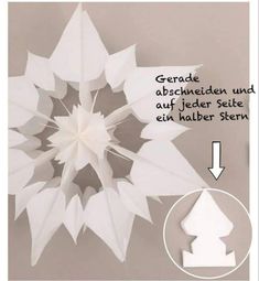 an origami snowflake is shown with the instructions for how to make it