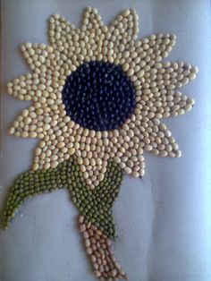 a sunflower made out of seed beads