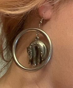 These stylized leopard earrings feature sleepy cats dangling in the center of hollow silver hoops. Each hoop measures approximately 2 inches across. These earrings have a vibe that reminds me of Laurel Burch pieces. They are ideal for any cat or leopard lover! In good vintage condition, with minor wear, especially to the backs. These unique earrings are sure to make a statement with any ensemble! Metal Jewelry With Cat Design, Metal Cat Design Round Jewelry, Cat Design Metal Drop Earrings, Sleepy Cats, Gold Cat Earrings, Kitten Earrings, Leopard Earrings, Lion Earrings, Black Cat Earrings