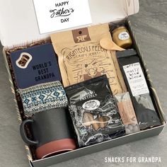 an open box containing coffee, snacks and other items