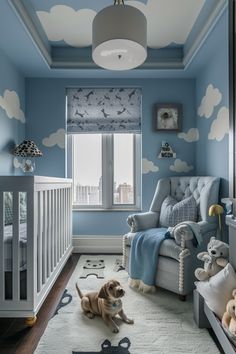 a baby's room with blue walls and clouds painted on the ceiling, along with a white crib