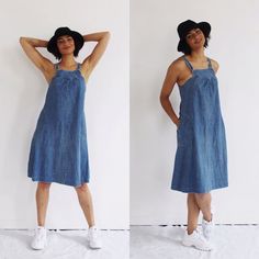 This is the perfect soft as a feather and lightweight 70s denim overall dress, with stitched full circle pockets and ultra-comfy tent cut. Made by Foxmoor, tagged sz. 5. 100% Cotton. Not pinned or altered on model in any way. Measures: Bust: 32”Waist: 36”Hips: up to 44”Length: 42”Condition: excellent. FOLLOW US ON INSTAGRAM FOR DEALS AND SNEAK PEEKS! @Wildthingvintageinstagram.com/wildthingvintageTwitter: @WildthingpeckMessage me any time for further details or questions. Please note there is a Medium Wash Cotton Denim Dress With Pockets, Summer Indigo Denim Dress With Pockets, Retro Cotton Denim Dress With Pockets, Vintage Denim Blue Denim Dress With Pockets, Spring Cotton Pinafore Dress With Pockets, Vintage Medium Wash Denim Dress With Pockets, Retro Summer Cotton Denim Dress, Retro Blue Denim Dress With Pockets, Casual Denim Pinafore Dress With Pockets