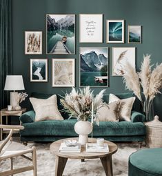 a living room filled with green couches and pictures on the wall above them,